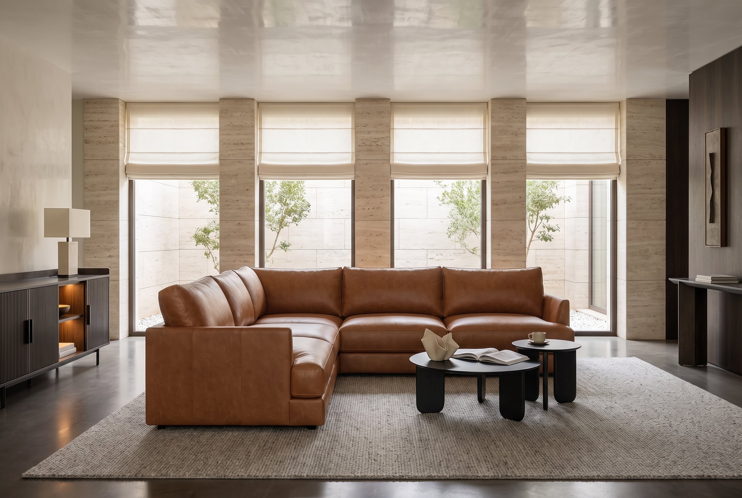 Serena corner sectional in Cognac in a calm living room with tall windows and linen blinds