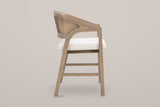 Sermoneta counter stool in Natural Ash, side view showing the sweeping arm, the 24.25 inch seat height and the footrest bars