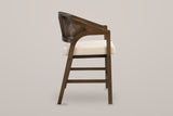 Sermoneta counter stool in Walnut, side view showing the sweeping arm, the 24.25 inch seat height and the footrest bars