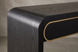 Close-up of the black top turning down through a soft rounded bend into the slab leg