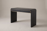 Sestri waterfall console table in black, three-quarter view on a warm grey studio backdrop
