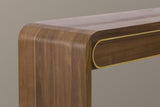 Close-up of the walnut top turning down through a soft rounded bend into the slab leg