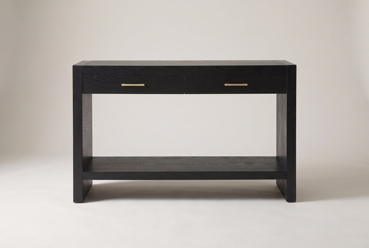 Sibari console table in black, straight front view: two drawers with gold-tone pulls, slab sides and a low shelf
