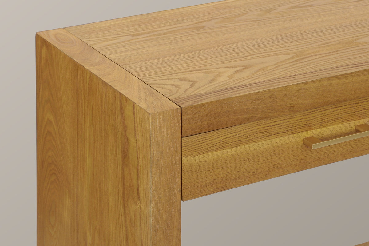 Close-up of the top corner where the Natural slab side frames the top and the drawer