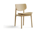 Simone dining chair in natural oak, three-quarter view on a white background