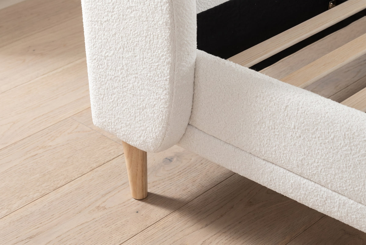 Close-up of the wing foot, a tapered rubberwood leg and the boucle side rail