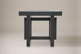 Soave side table in black, straight front view: thick square top, two posts, an upper and a lower rail