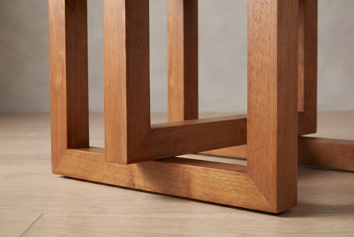 Close-up of the base: square rubberwood frames with 45-degree mitred corners, one hanging frame overlapping a standing frame