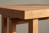 Close-up of the corner of the 2.4-inch top: open oak-like grain on the face, straight grain on the edge