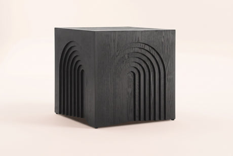 Sondrio cube side table in Black, three-quarter view on a warm grey studio backdrop