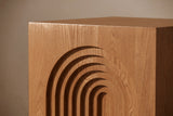Close-up of the stepped arch crown and the open wood grain running into each step