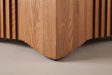 Close-up of a bottom corner: the edge rising in small steps and a black rubber pad