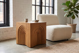 Sondrio side table beside a cream boucle chair in a Montreal loft with whitewashed brick