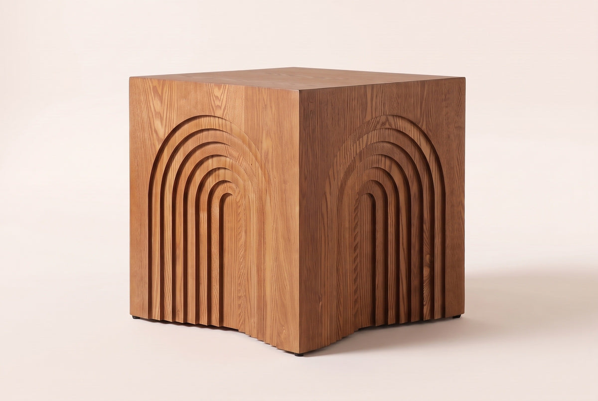 Sondrio cube side table in Natural & Light Brown, three-quarter view on a warm grey studio backdrop