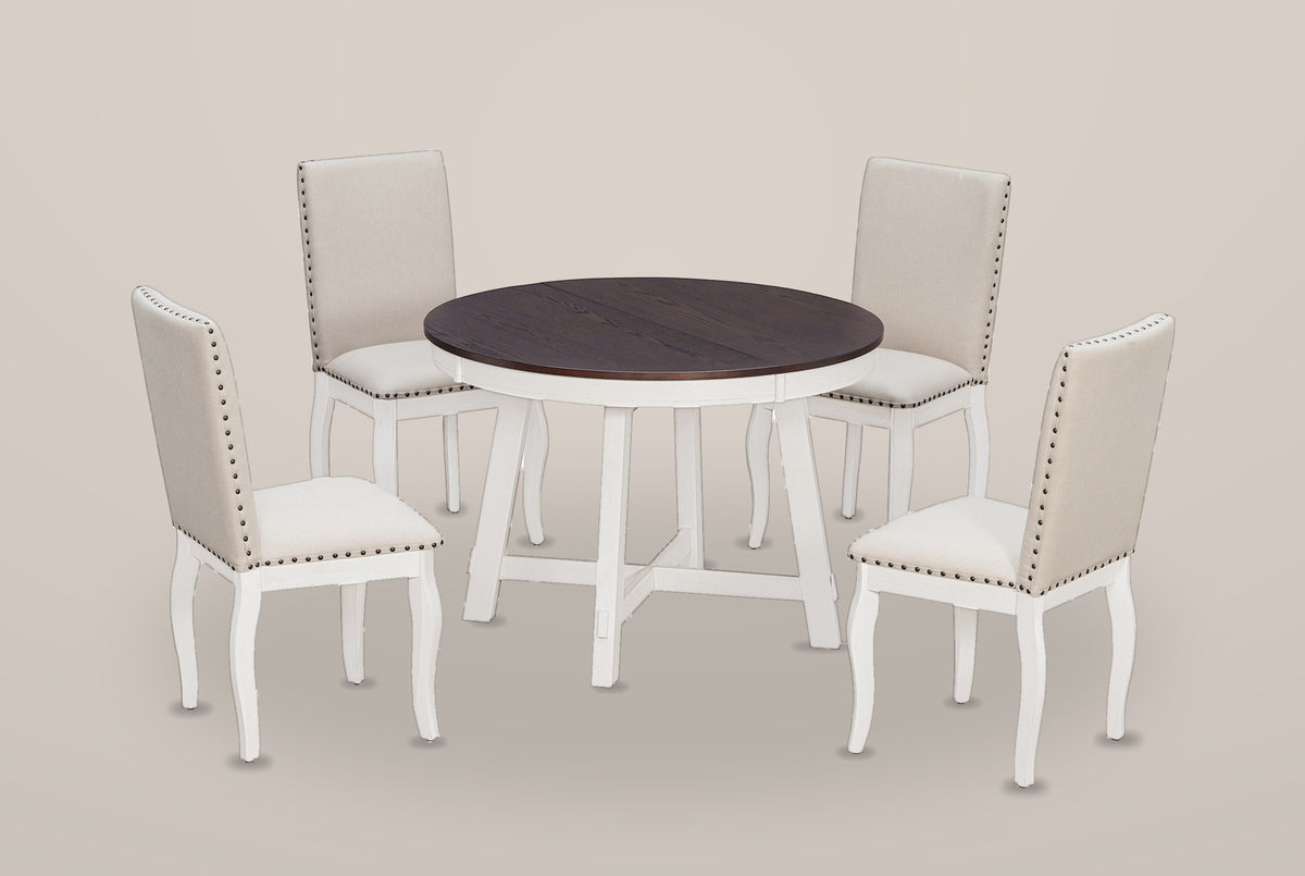 Spilamberto five-piece dining set on a warm grey studio backdrop: a round table with a dark top and a white X-stretcher base