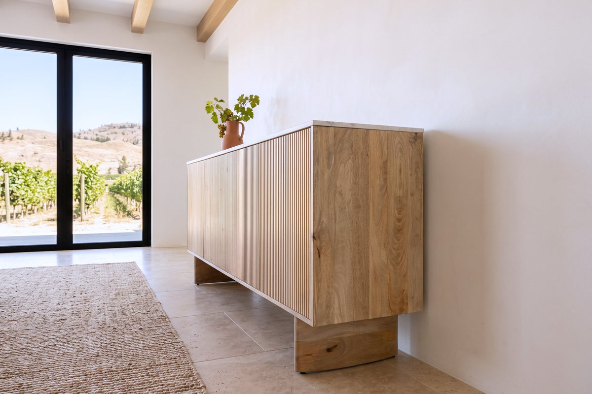Staffolo sideboard in Natural seen from the end against a white plaster wall in an Oliver vineyard house