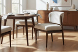 Sutton linen taupe dining chairs at a round table in a sunlit room