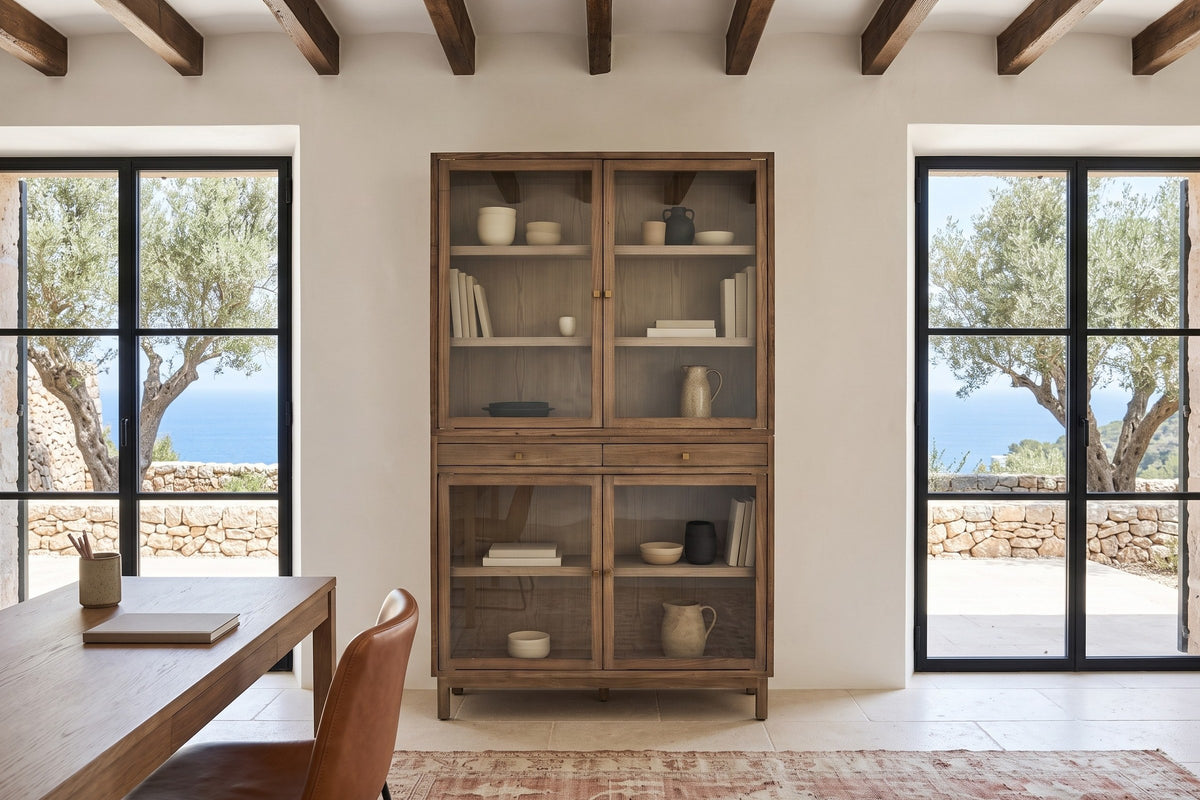 Suvereto display cabinet in Smokey Grey, front view, in a lime plaster study in a Valldemossa stone house