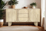 Sylvan sideboard styled with plants and a bowl below framed art in a bright room