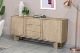 Sylvan sideboard with a vase, typewriter and copper floor lamp against a mauve wall