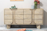 Sylvan dresser styled with flowers and books beside floor cushions