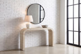 Tarvisio console table in natural in a Montreal loft entry, a white lamp and a stone bowl on top, a round mirror above
