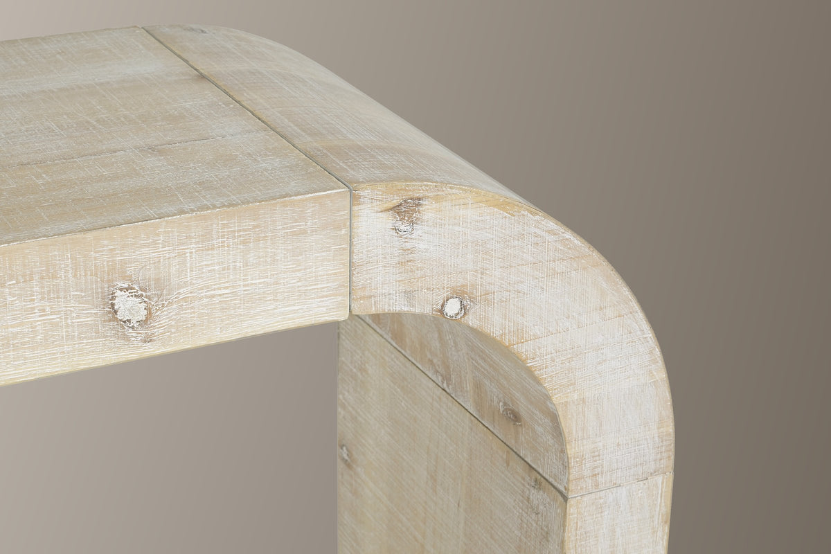 Close-up of a top corner in the natural finish: the rough-sawn whitewashed top with knots