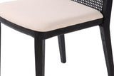 Close-up of the Teggiano seat: the Oyster Linen cushion on a slim black ash seat rail and square tapered legs