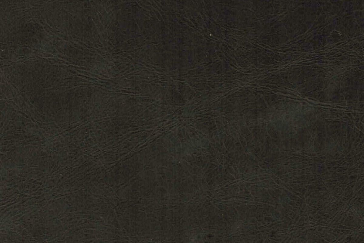 Close-up of the black genuine leather: a fine natural grain