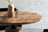 Thorne acacia tabletop with a ceramic vase and the iron column below
