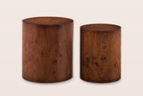 Tirano drum side tables side by side, straight front view: two plain cylinders, the smaller one narrower and a little lower