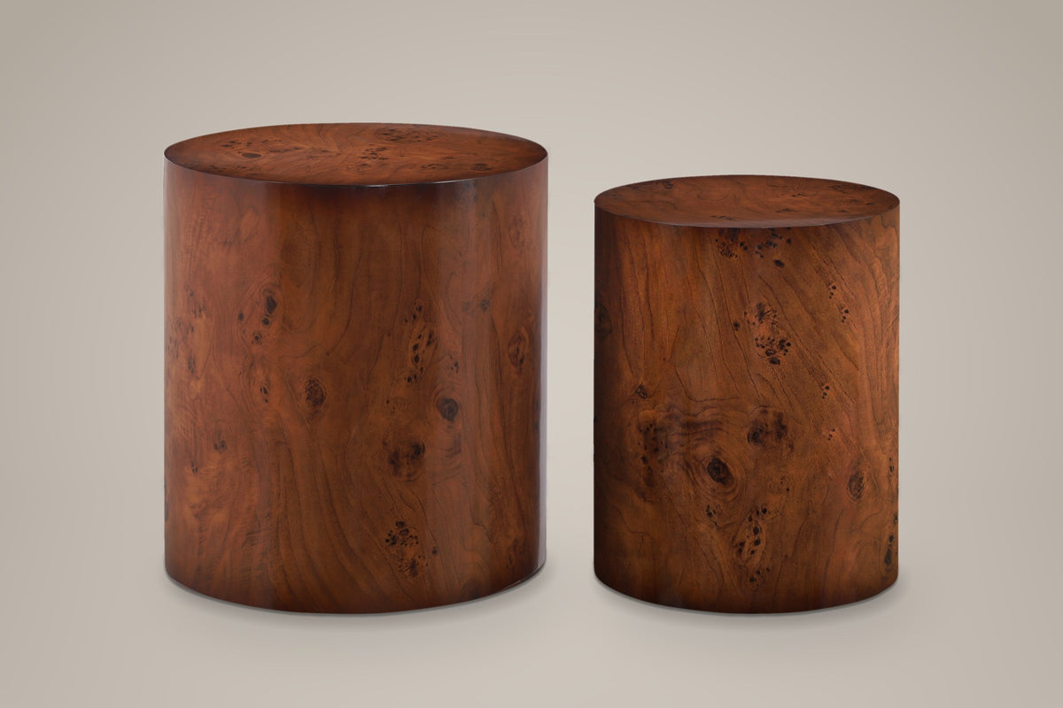 Tirano drum side tables side by side, straight front view: two plain cylinders, the smaller one narrower and a little lower