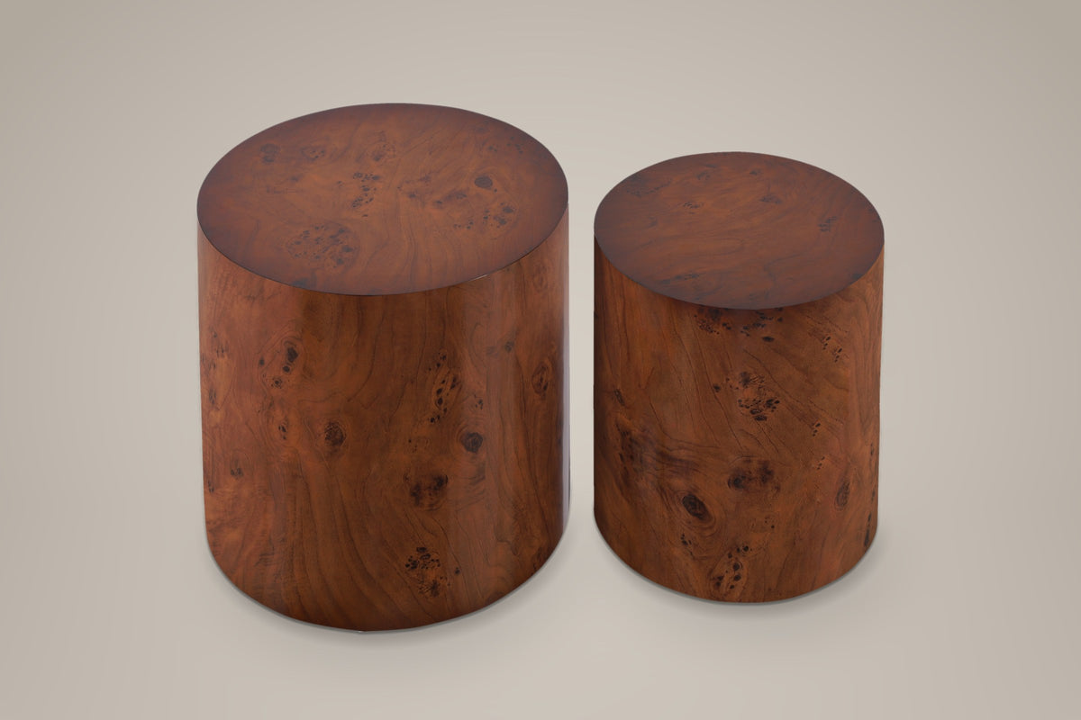 Tirano drum side tables, a large and a small drum in a walnut burl veneer finish, seen from above on a warm grey studio backdrop