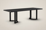 Tolmezzo 95-inch black dining table on two U-shaped trestle bases with half-moon feet, three-quarter view