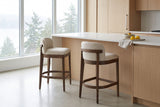 Two Torgiano counter stools at a white-oak and white-quartz kitchen island in a Vancouver condo