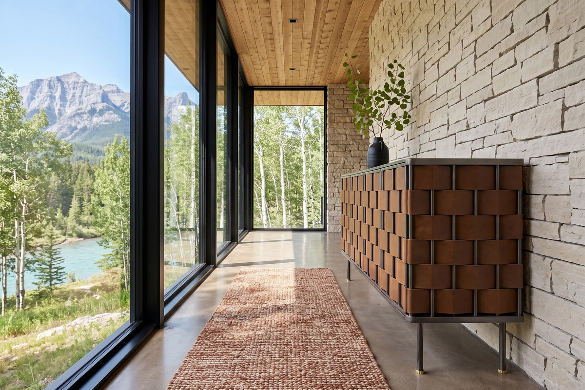 Trequanda sideboard in Brown seen from the end against dry-stack limestone in an Exshaw house in the Bow Valley