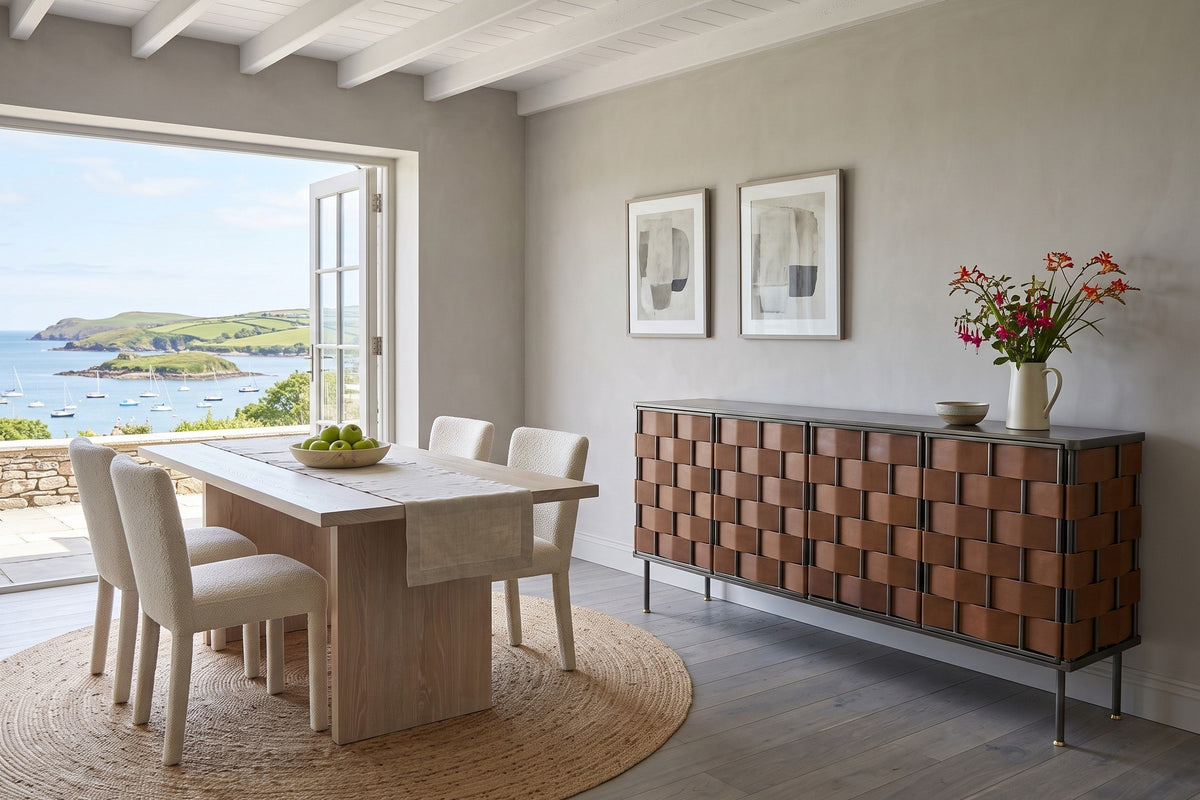 Trequanda sideboard in Brown against warm grey limewash in a Schull harbour house in West Cork, beside a dining table