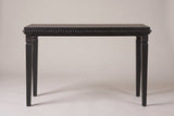 Treviso console table in Black, straight front view: a row of round wooden beads under the top, four square stepped legs