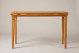 Treviso console table in Natural, straight front view: a row of round wooden beads under the top, four square stepped legs