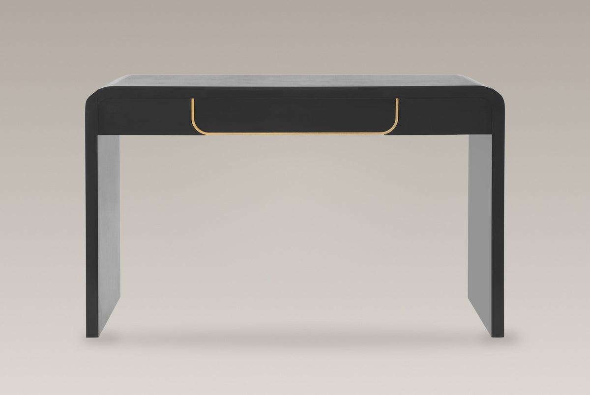 Trieste console table in matte black, straight front view: one centred drawer edged in a gold-tone U, two slab legs