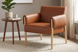 Upton saddle faux leather chair beside a small side table in a living room