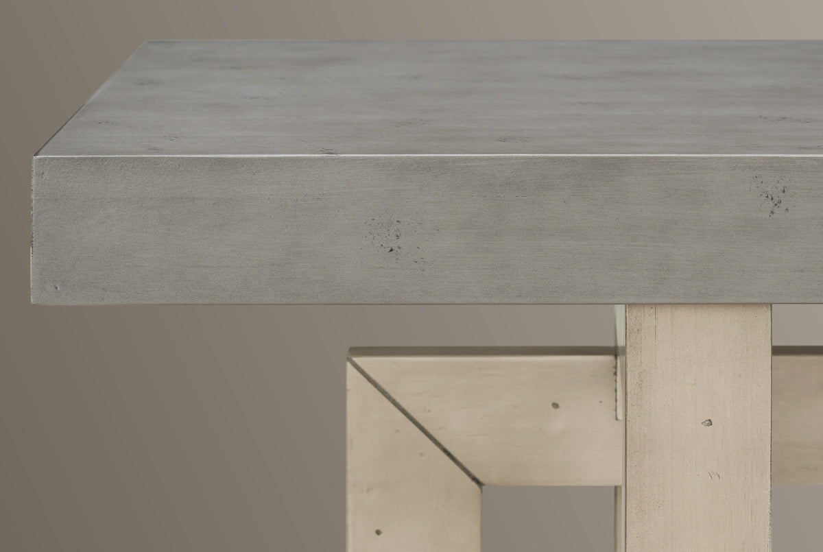 Close-up of the 2.4-inch gray top with its square edge and distressed specks, above a mitred frame corner and the front post