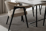 Vance mushroom faux leather dining armchairs at a modern dining table on a grey rug