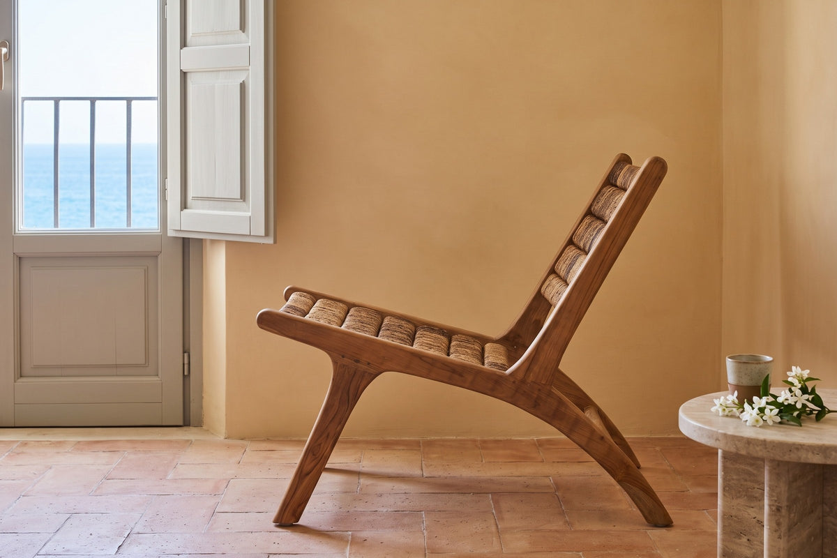 Varigotti accent chair in side profile in a palazzo apartment in Ortigia, Siracusa