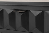 Close-up of a black-painted honeycomb drawer front with its distressed iron lip pull on the top edge