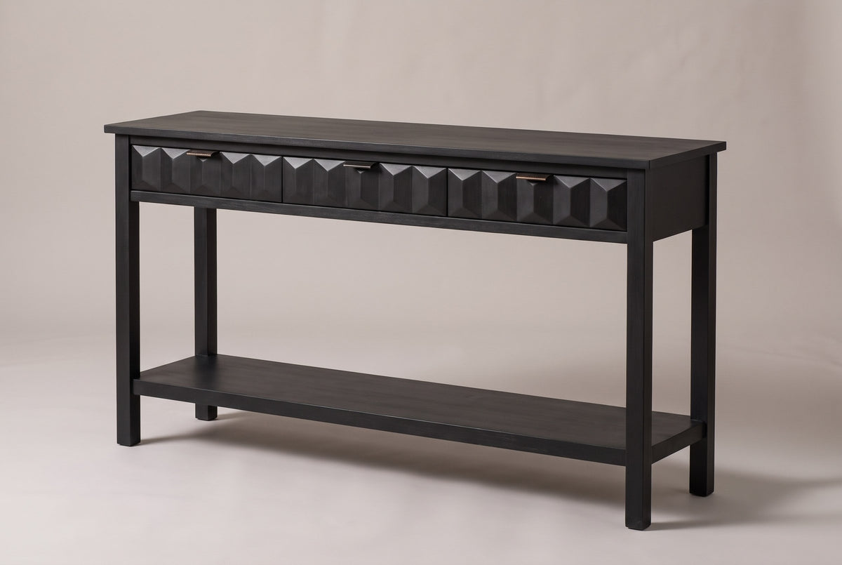 Velletri 3-drawer console table in black, three-quarter view on a warm grey studio backdrop