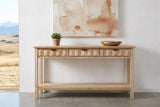 Velletri console table against a white plaster wall in a Calgary foothills house, a succulent and a wooden bowl on top