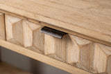 Close-up of a honeycomb-carved fir drawer front with its distressed iron lip pull on the top edge