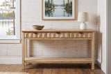 Velletri console table in the pine-panelled entry of a Muskoka lake cottage, a stoneware bowl and a white lamp on top