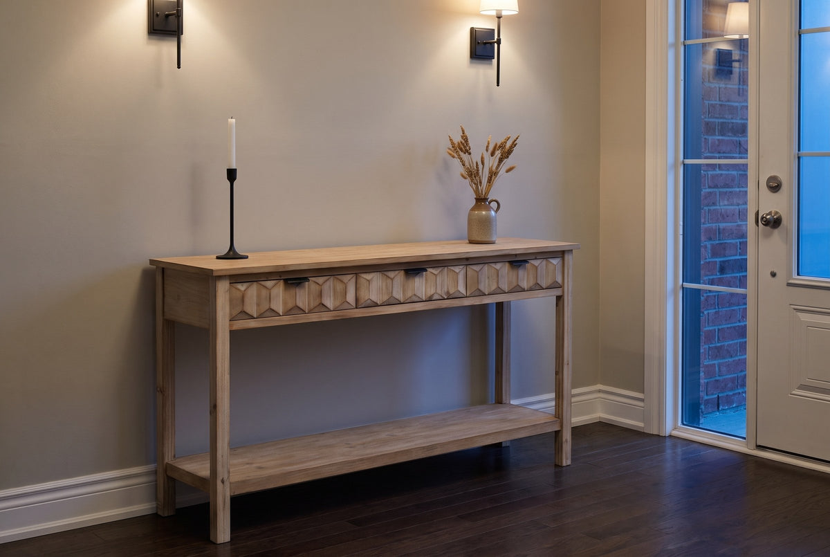 Velletri console table in an Ottawa townhouse front hall at dusk, iron sconces lit, a candlestick and dried grasses on top